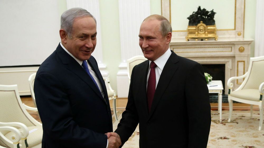 Two elderly war criminals and long time friends shake hands