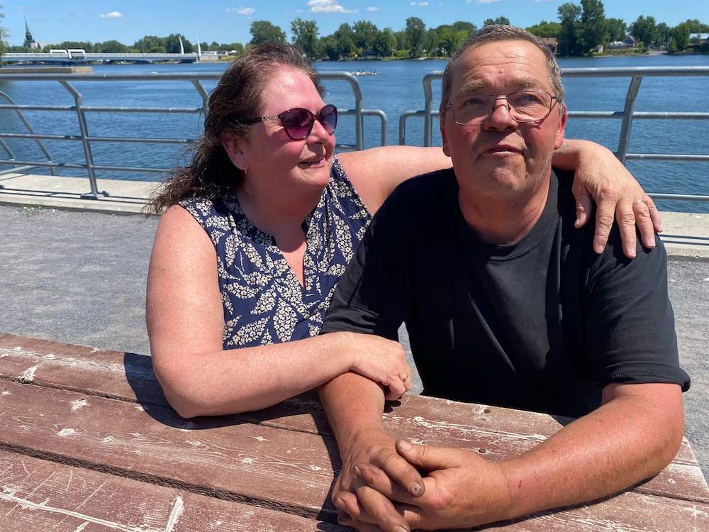 Man with his wife, visibly shaken after the ordeal 