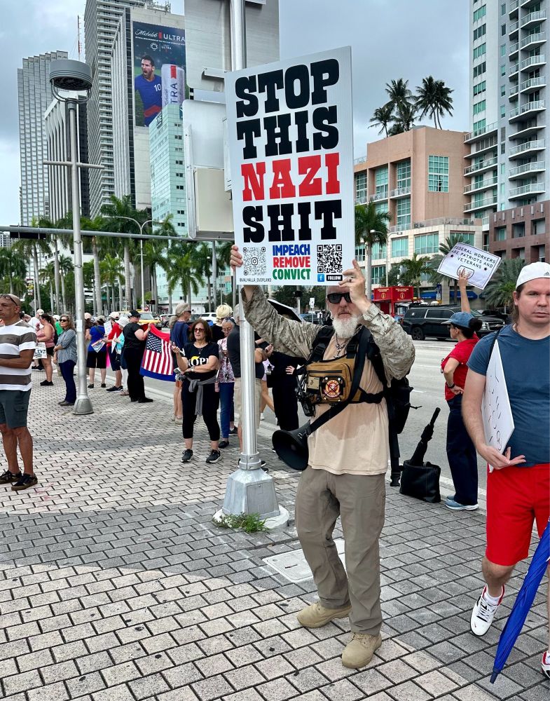 US veteran holds sign that reads 