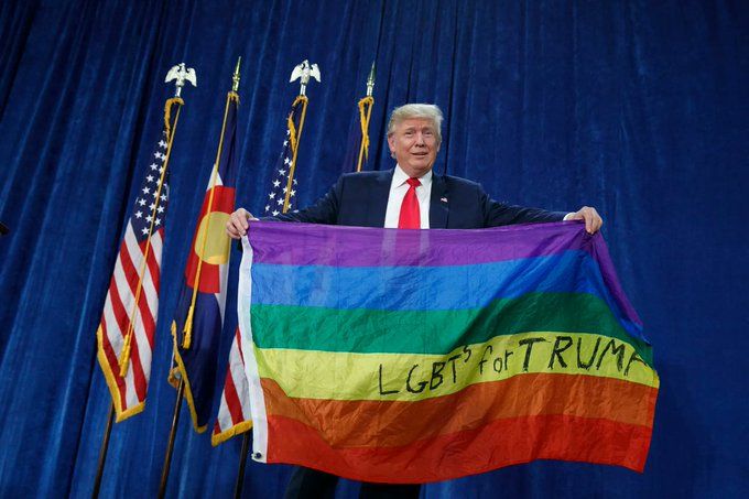 rapist holds LGBT flag