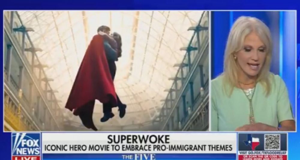 Nazis reject Superman which was created by Canadian Joe Shuster and USian Jerry Siegel. Woman talking on television sets calling Superman superwoke.