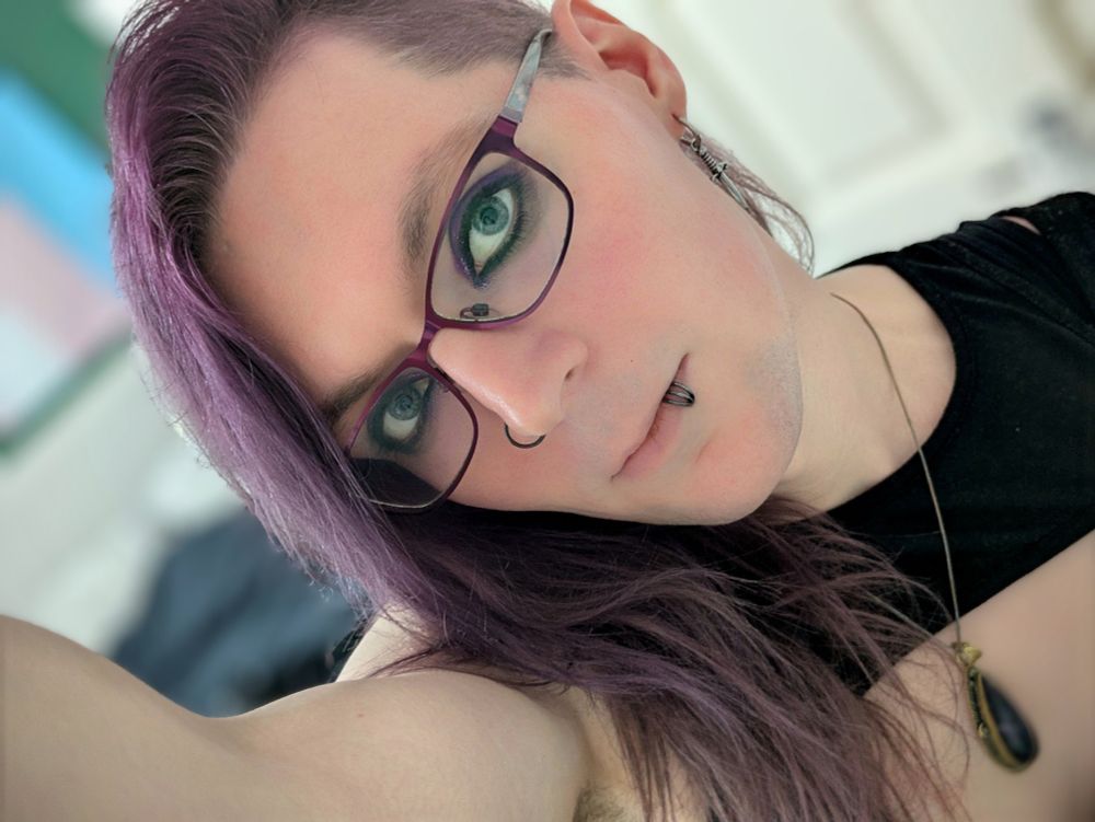 A close up selfie of Luci taken from a somewhat jaunty angle. She stares intently, you can feel yourself beginning to ovulate...
Also her eye makeup looks nice.