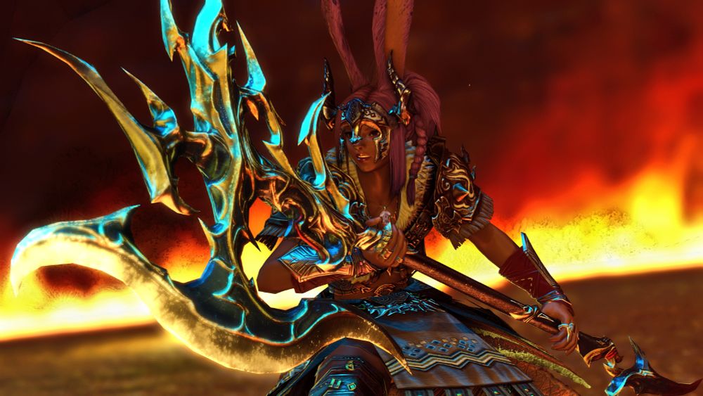 Kit Hareington, a brown Viera WAR from FFXIV, wears traditional warrior's fur and leather armor, a horned headpiece, and wielding a greataxe, stands with her ears at attention in front of a wall of fire. The axe blade glwos, she grits her teeth.