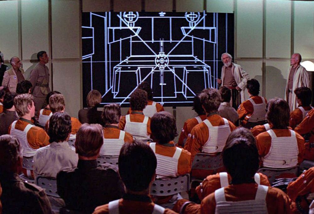 Screenshot from Star Wars scene where rebel pilots are being briefed on the plan to attack the Death Star.