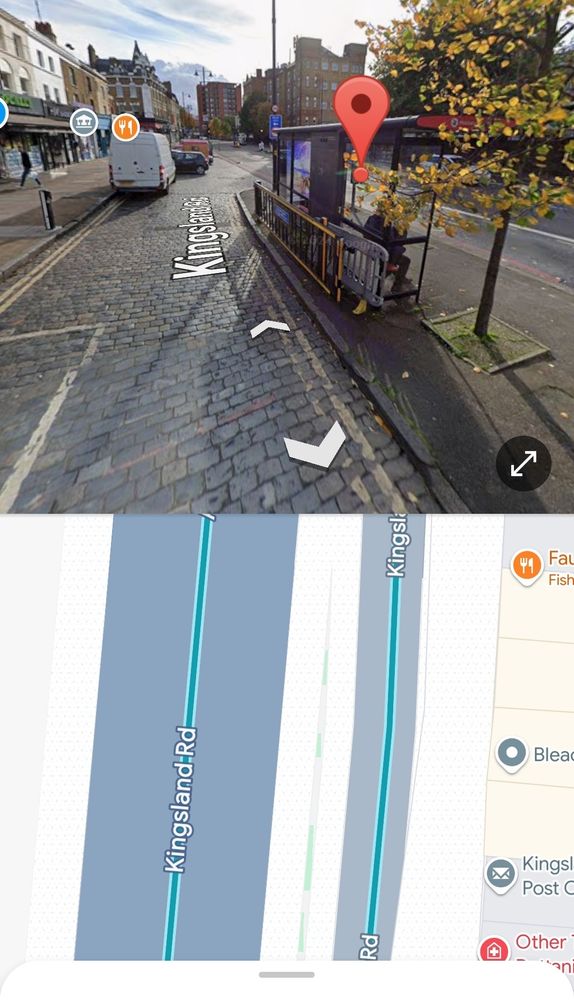 A photo of a road behind a bus stop in Hackney. There are no crossing points. 