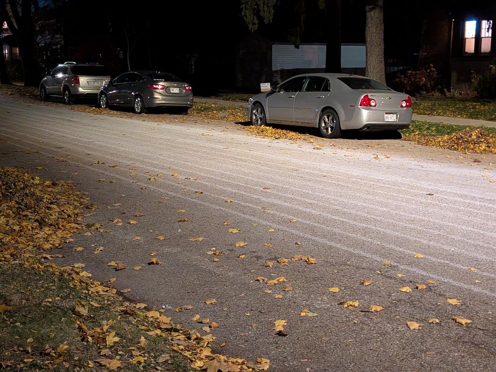 Visible white brine lines on a concrete Street