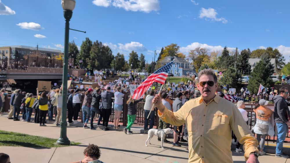 Moi... gratified by "small victory" achieved from the incredible energy generated and shared by so many of the sane of U.S. on "No Kings Day" event, Arvada, CO; on 10/18/2025. 