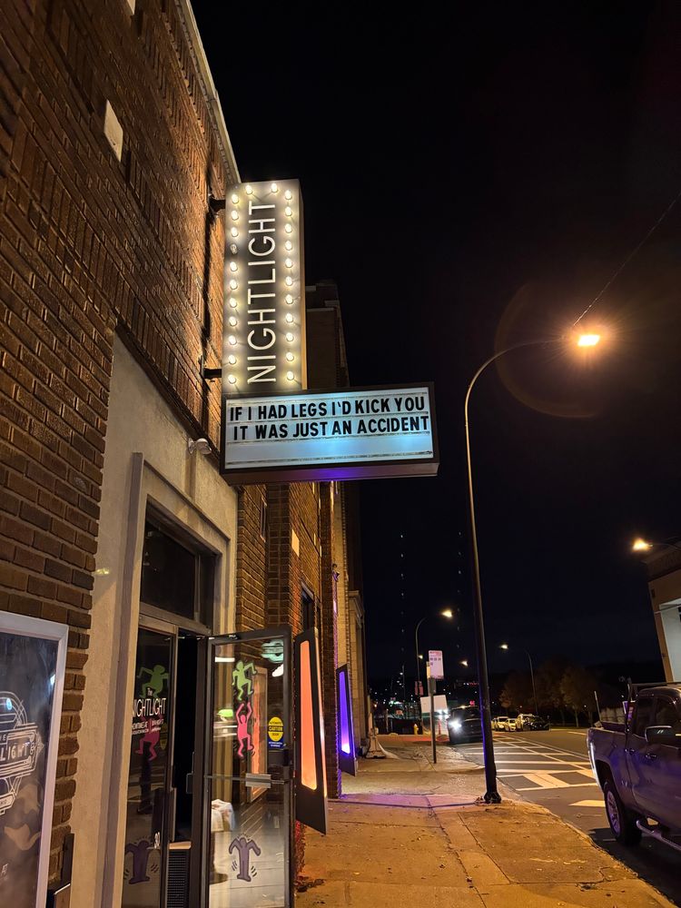 a movie marquee that’s says nightlight and if I had legs I would kick you and it was just an accident 