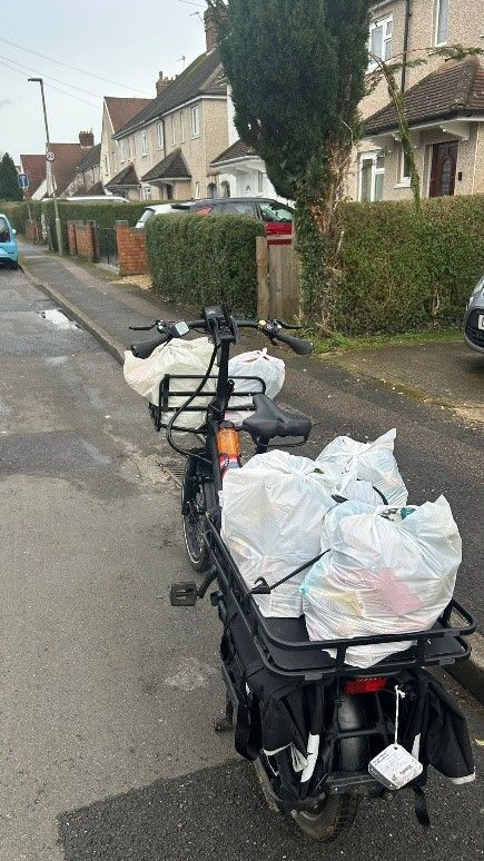 A picture of the OCA cargo bike loaded up with food for a delivery. 