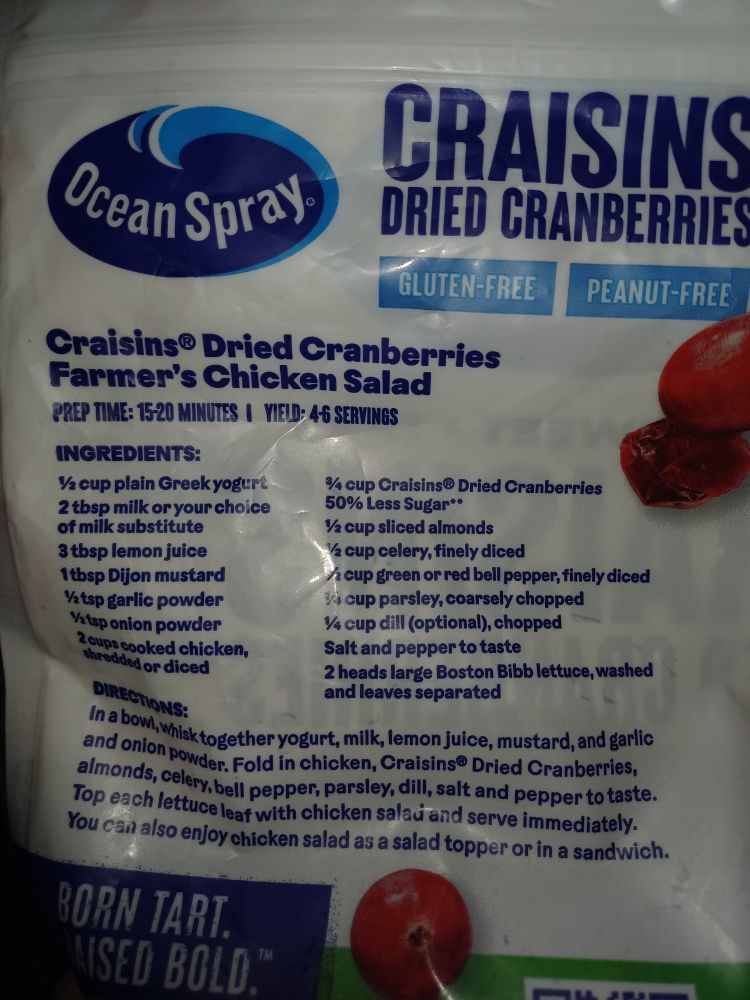 A bag of Ocean Spray dried cranberries with a recipe for Farmer's Chicken Salad. The recipe has dried cranberries in it.
