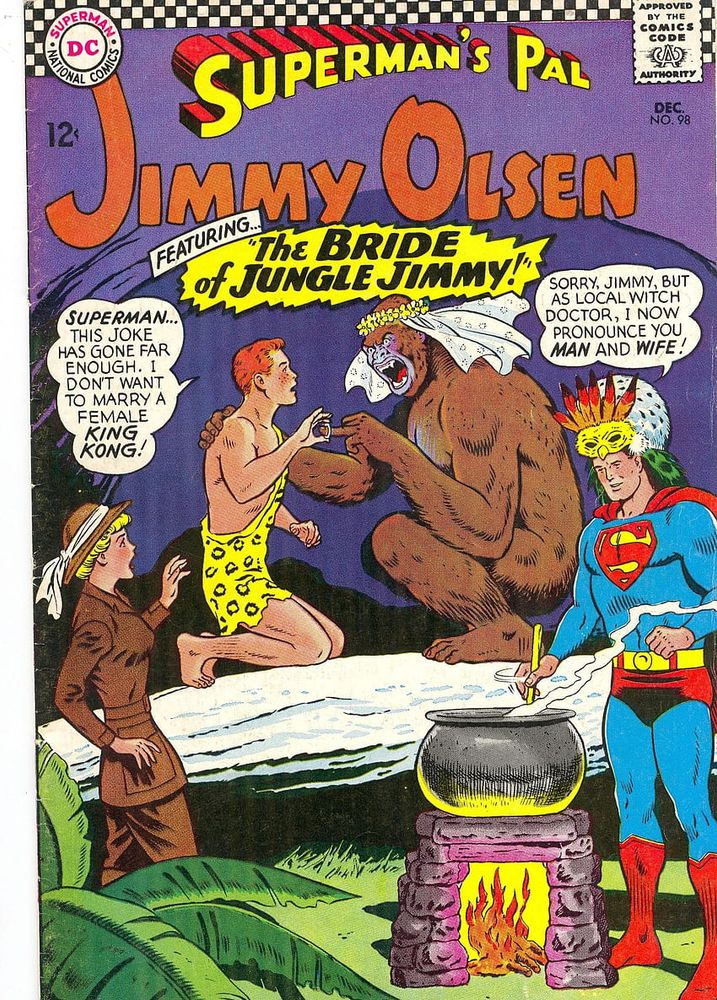 A comic cover for the series "Superman's Pal, Jimmy Olsen", specifically from December 1966, depicting Jimmy in a caveman outfit as he puts a wedding ring on the finger of a gorrilla with a bridal veil.

Superman is stirring a cauldron over a flame nearby with an odd headdress on.

"Superman...this joke has gone far enough. I don't want to marry a female King Kong!"

"Sorry, Jimmy, but as local witch doctor, I now pronounce you Man and Wife!"