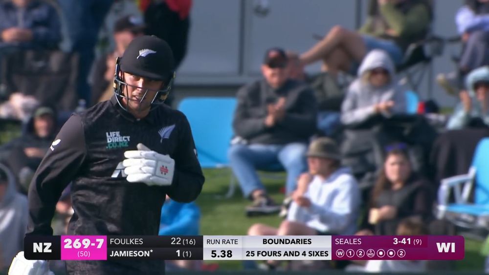 New Zealand batter Zak Foulkes jogs to the pavilion at the end of the innings, which ended on 269 for 7