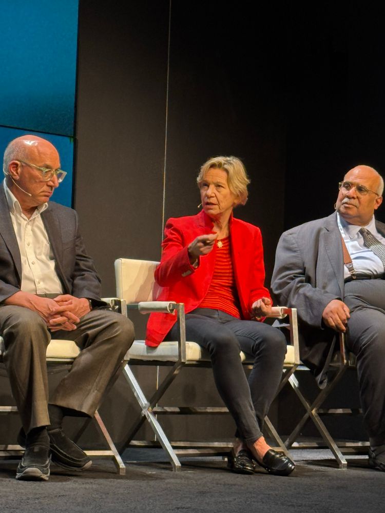 A woman in red talking 