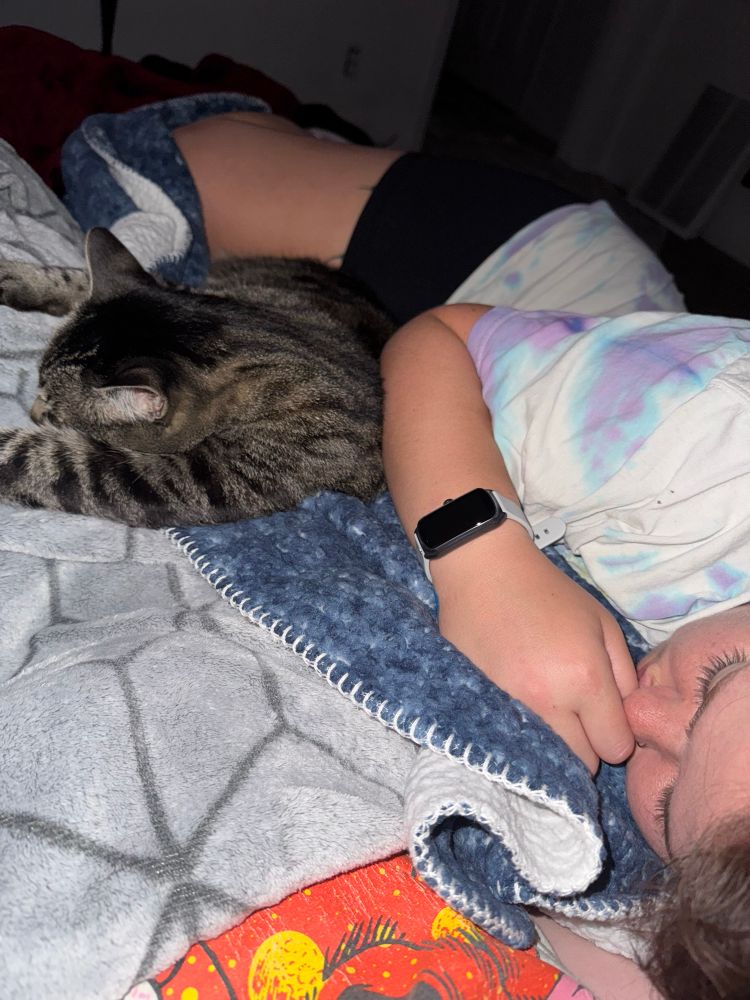 maddison’s girlfriend asleep with her cat kevin 