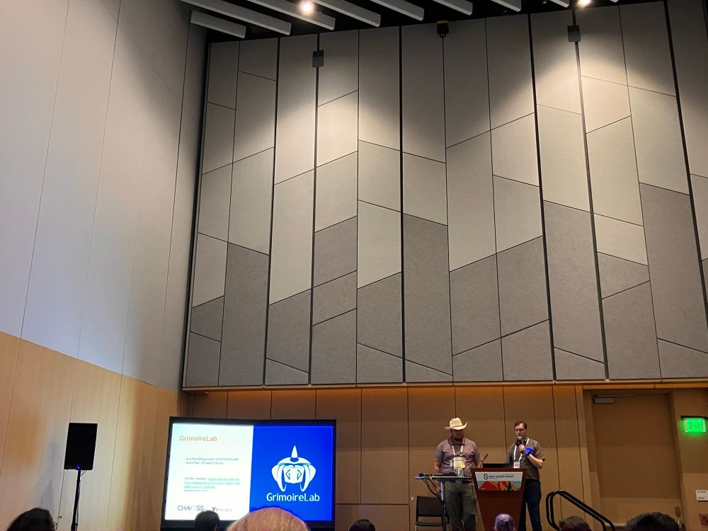 Terence and Georg talking about GrimoireLab on the lectern at CHAOSSCon