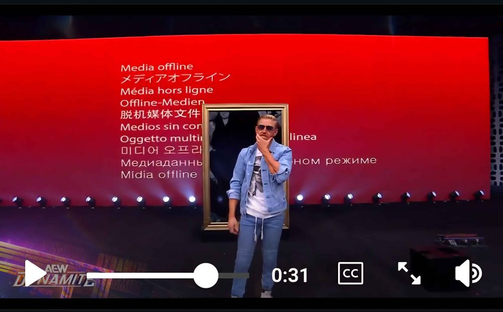Orange Cassidy in front of an intro graphic of a red background and white text saying Media Offline in various languages