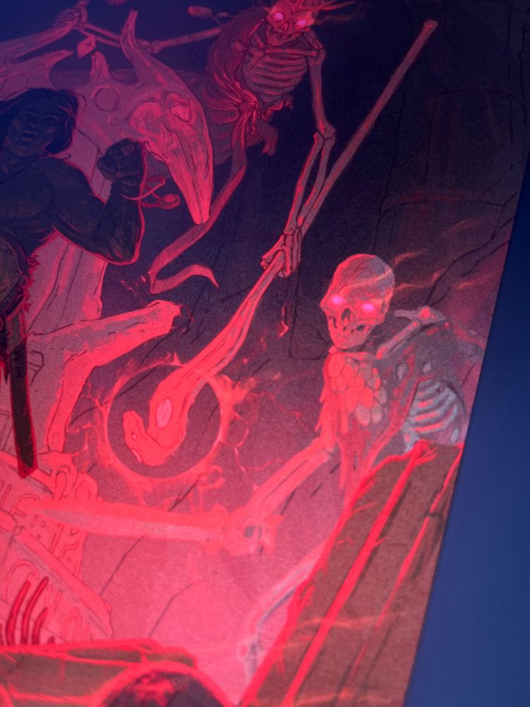 A skeleton lit in pink with flaming eyes
