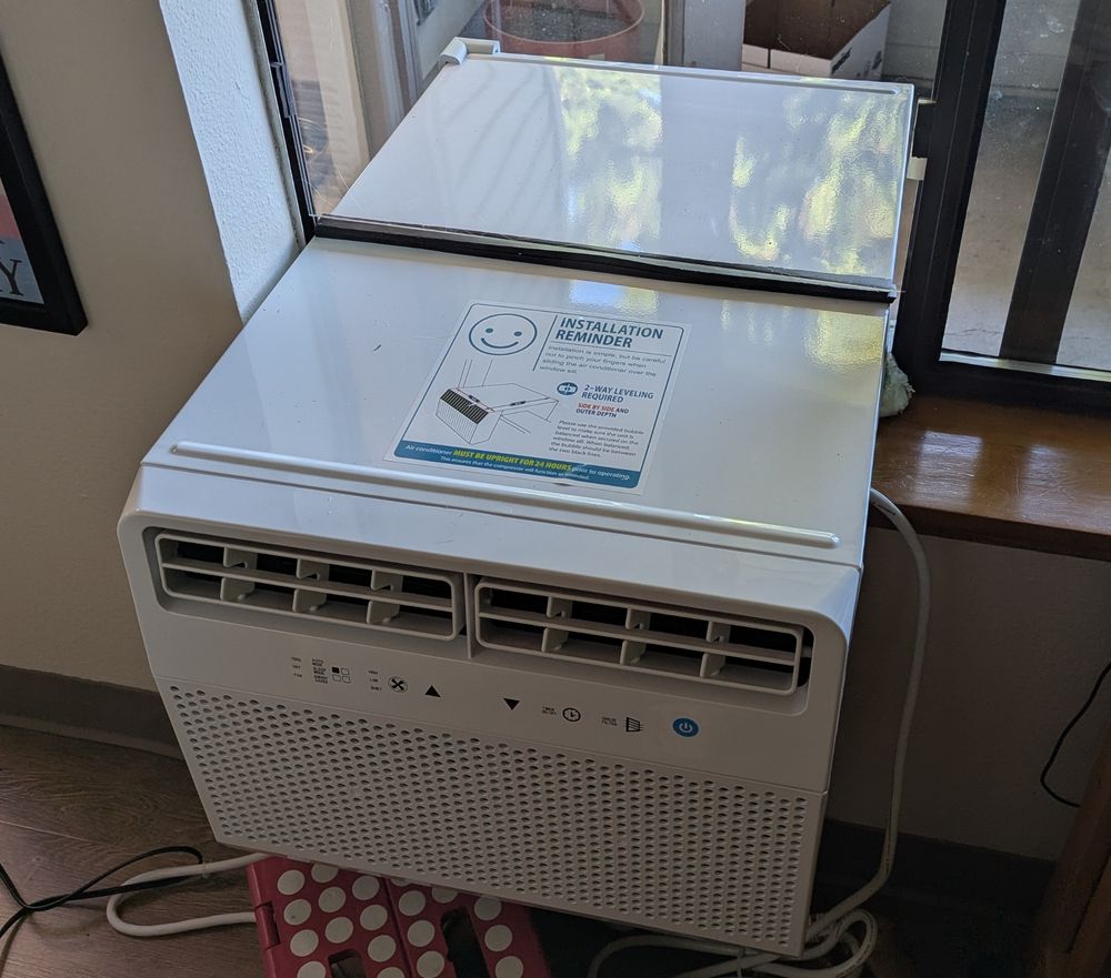 Photo of an air conditioning unit installed in a window