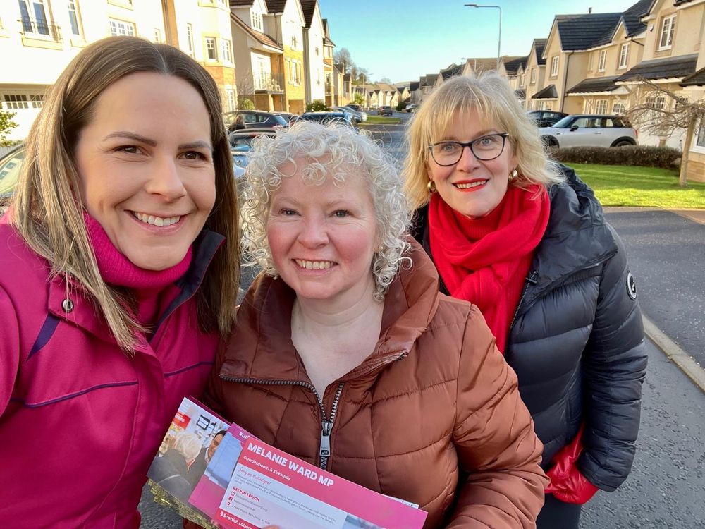 Melanie Ward MP and Claire Baker MSP on a sunny street in Burntisland with a Labour Party campaigner 