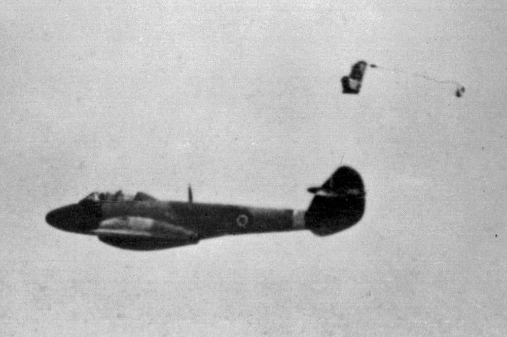 Image of Bernard Lynch successfully ejecting from the back seat of the Meteor 3 on this day in 1946. Lynch can be seen clearing the tail of the aircraft safely with the drogue chute pulling him clear from the aircraft.