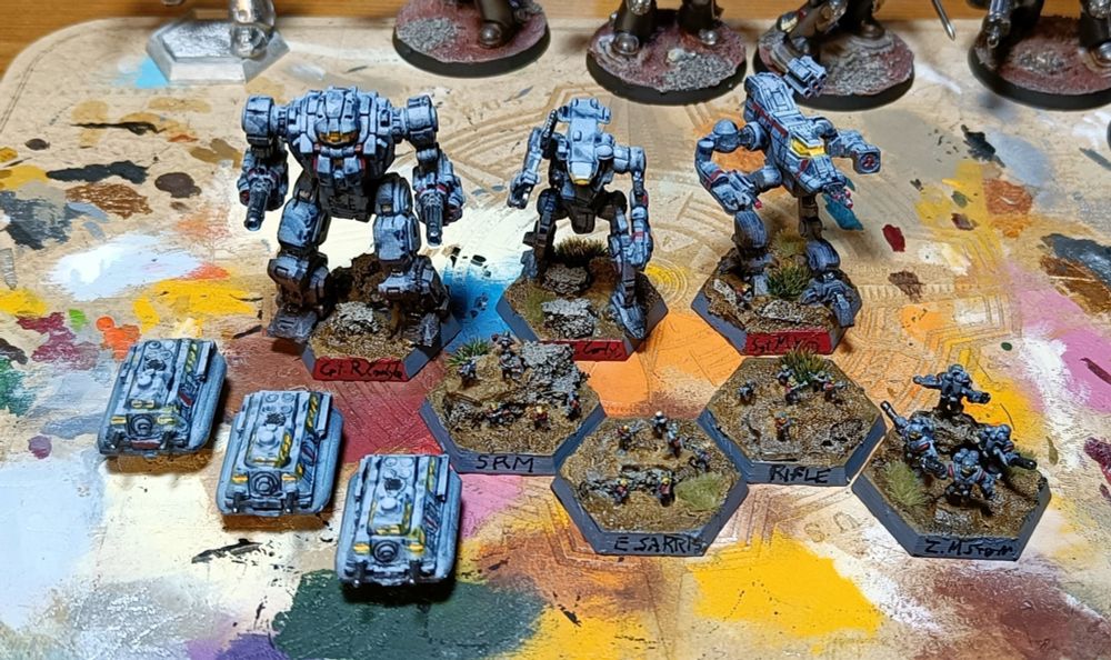 3 mechs, armored personnel carriers and infantry of the Grey Death Legion (Battletech)