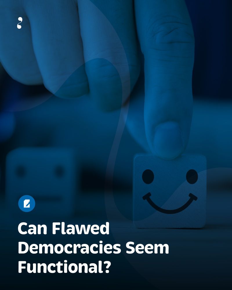 A close-up of a hand pressing a smiling face block while a sad face block sits blurred in the background, accompanied by the title: “Can Flawed Democracies Seem Functional?” Image credit: Adobe Stock / iHumnoi