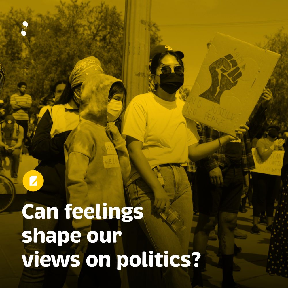 A protest scene with a yellow color overlay. A diverse group of people, including a person wearing sunglasses, a face mask, and a white t-shirt, hold signs. One prominent sign features a raised fist and the words 'NO JUSTICE NO PEACE.' A child in a hoodie and wearing a mask stands next to the person holding the sign. White bold text at the bottom reads: 'Can feelings shape our views on politics?