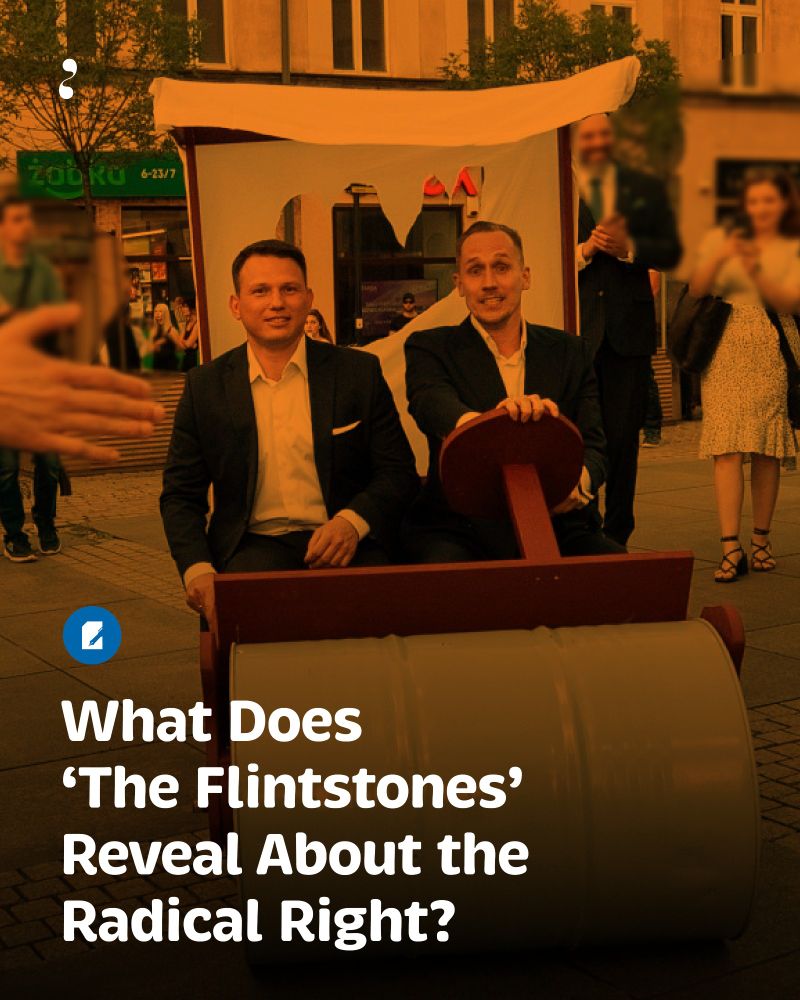 Two men (Konrad Berkowicz, Polish politician on the right) in suits are sitting in a funny, homemade Flintstones-style car—a barrel serves as the front wheel, and it has a fabric roof. Amused onlookers snapped photos as the scene unfolded on the city street. Photo Credit: Social Media Reproduction/ MORES.