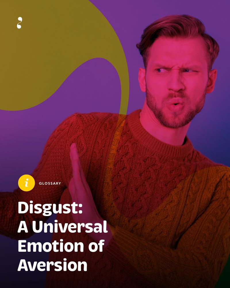 A man with a scrunched face and furrowed brow expresses disgust, holding one hand up in a defensive gesture. He wears a textured orange sweater against a vibrant purple background, overlaid with abstract yellow and pink shapes. The image includes the text: “Glossary – Disgust: A Universal Emotion of Aversion” in bold white lettering. Image: MORES/ Photo: Adobe Stock.
