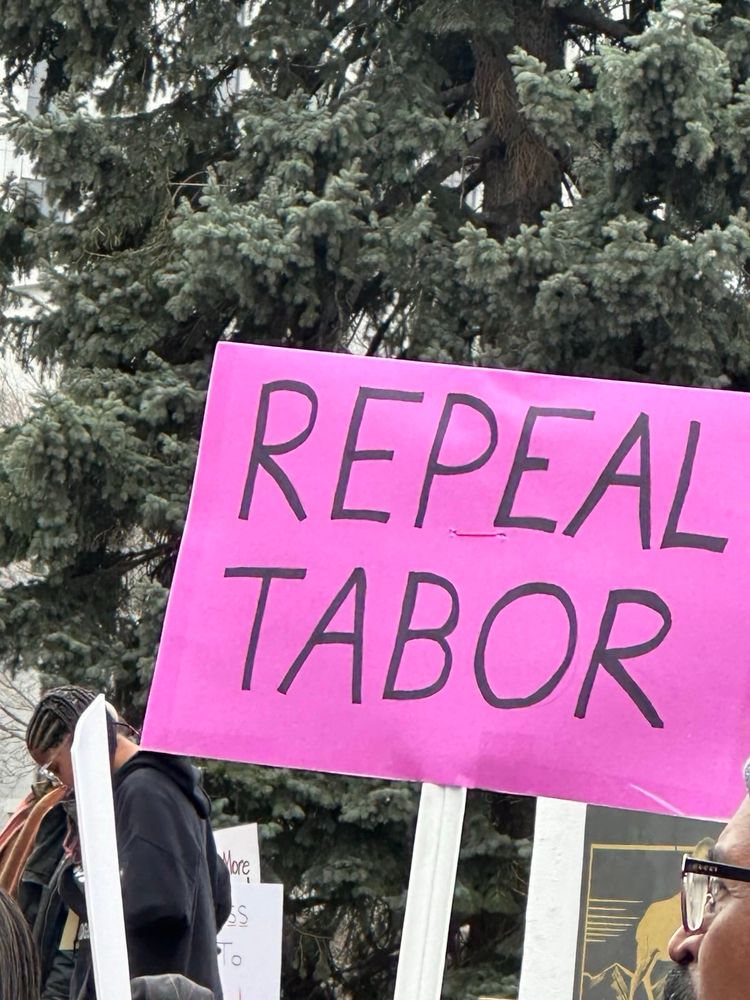 Protest sign that reads, ‘repeal TABOR’ 