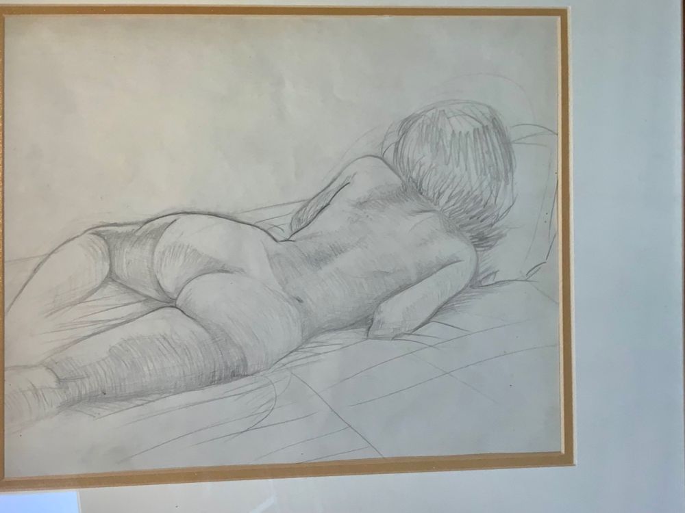 Young woman reclining; the view is callypigean