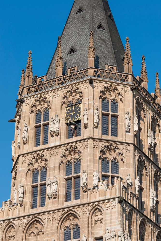A shot of Cologne's town hall, ornate and adorned with statues of historical figures. 