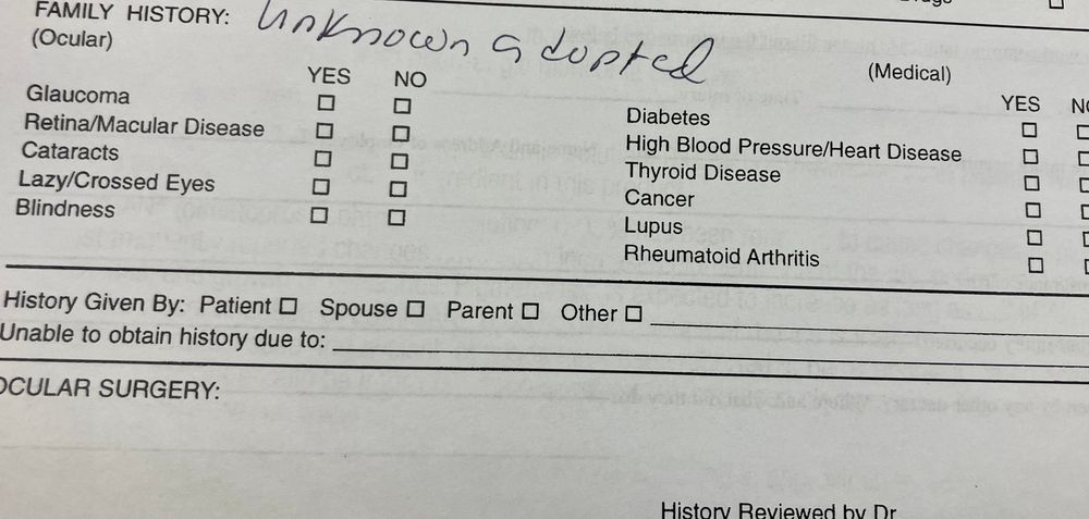 Medical history intake form asking about family medical history on which I have scrawled UNKNOWN ADOPTED