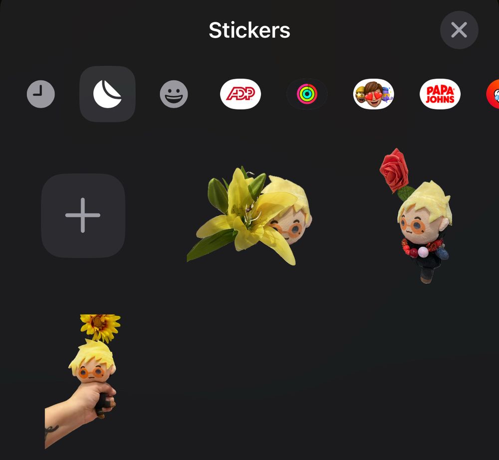 same image as the image in the original qrt, but now the newest sticker is of a lily flower, knock off vash plushies severed head peeking from behind it