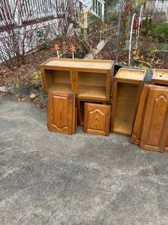 HOLYOKE Kitchen Cabinets: Kitchen cabinets that are in good condition and have been stored in a dry basement for several years. The doors and faces of the cabinets are hardwood. Had grand plans of redoing the kitchen with them, but it never came to b 