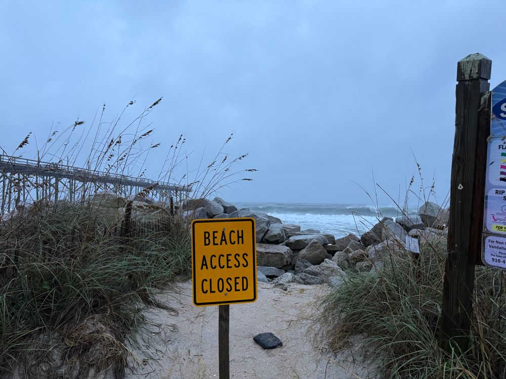 Beach Access Closed.

... I lied in the previous caption:  those boulders are not small.

The pier seen to the left thru the sea oats is definitely worse for wear... we could see one of the supports swinging freely in the wind later 