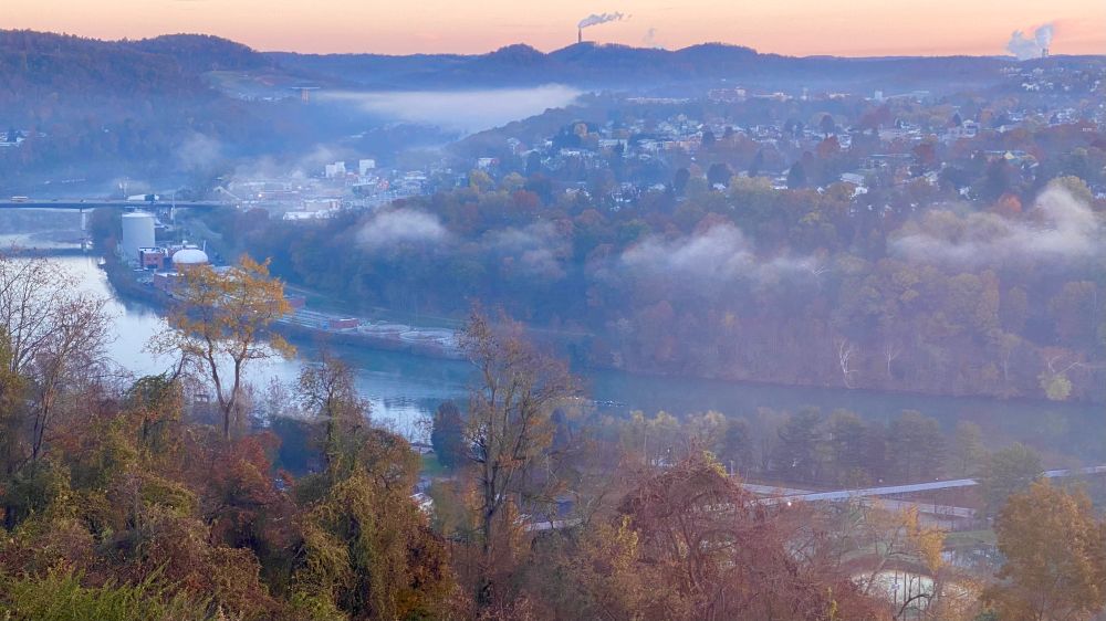 Near Star City, West Virginia. Patches of morning fog over the Monongahela River and more settled into the valley in the background.