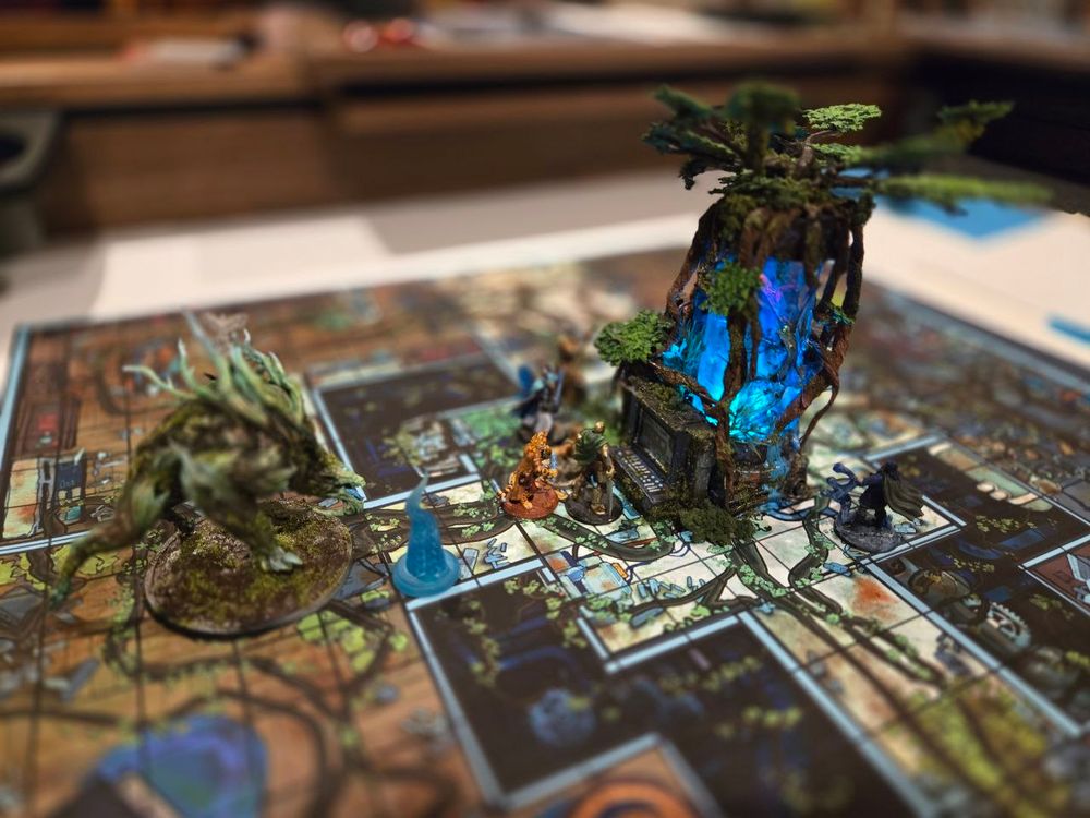 A picture of a boss battle between my DnD players and a large root monster over the power core of a large arcane laboratory. 