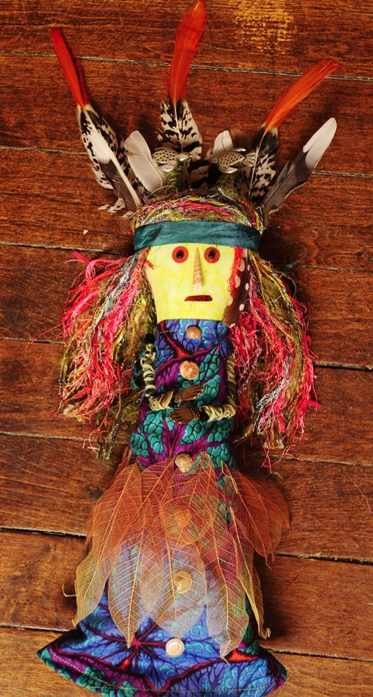 Handmade doll who worships the wildness and sleeps on the ground under the stars. She dresses in leaves and feathers and moss. 