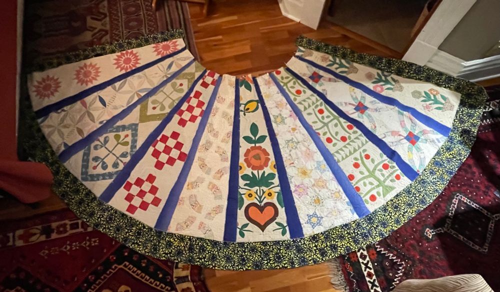 Cape of the ancestor women. Made from antique quilts. This piece is about remembering that the women before me put their joys and sorrows into their hand work. I gather strength from what they made it through.