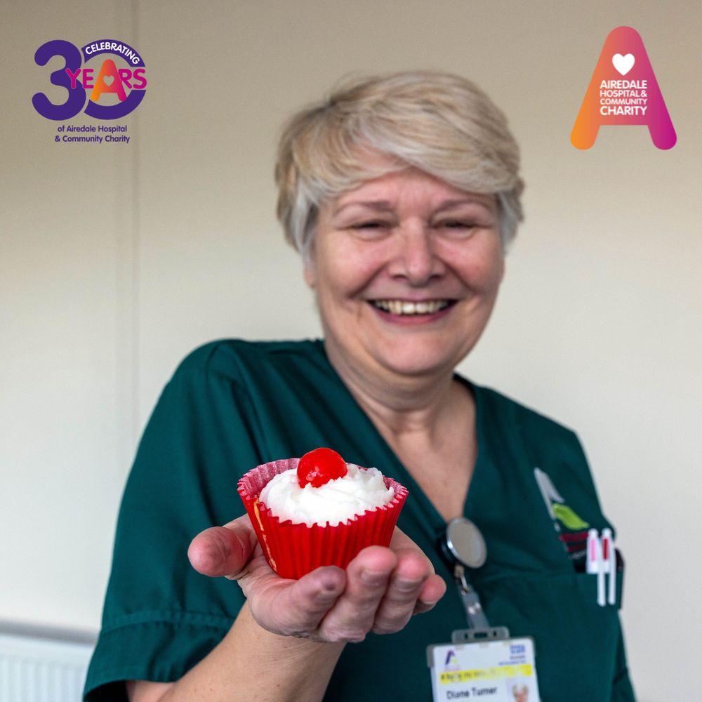 Image of a woman holding a cupcake
