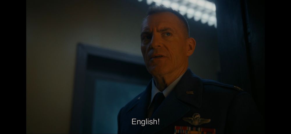 A white man screaming "English!" at people speaking another language. 