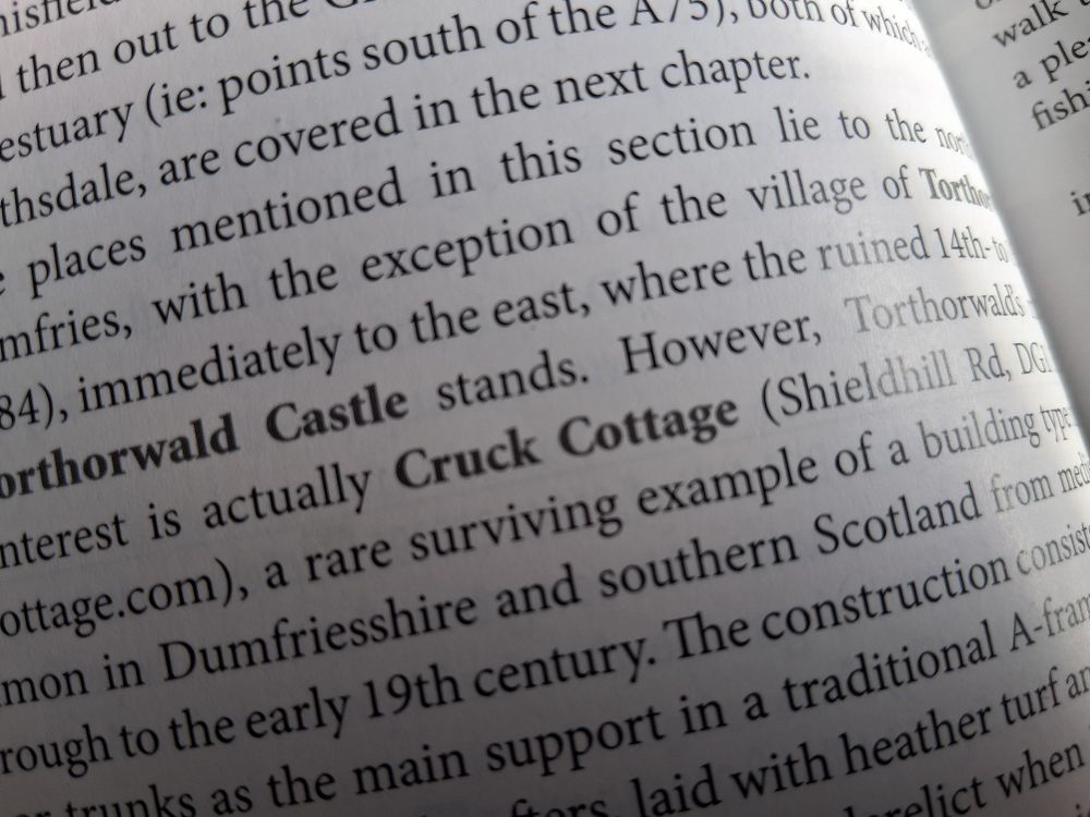 A close up of a text relating to the Cruck Cottage method of construction.