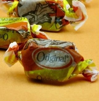butterscotch or Carmel or whatever, yellow and orange wrapper that is always at least 3 years old and hard as a rock