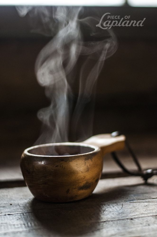 steaming liquid in a kuksa (traditional lapland wooden cup)