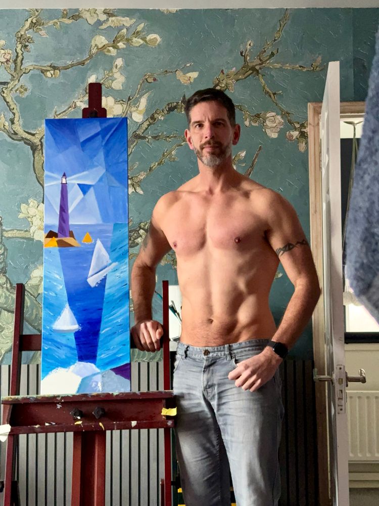 Shirtless fit Gay man artists and painter next to a skinny blue modern abstract and geometric landscape in blue tones featuring a lighthouse and nautical themes