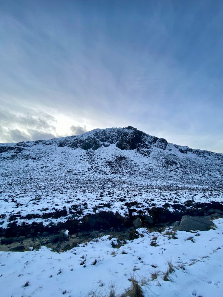 A snowy mountain peak. 