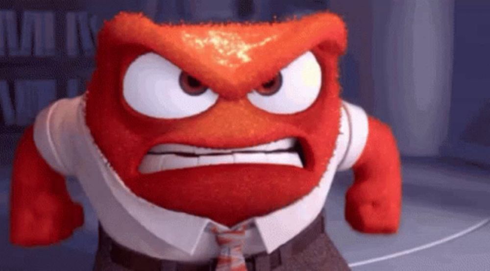 a cartoon character with an angry face is wearing a tie and a shirt .