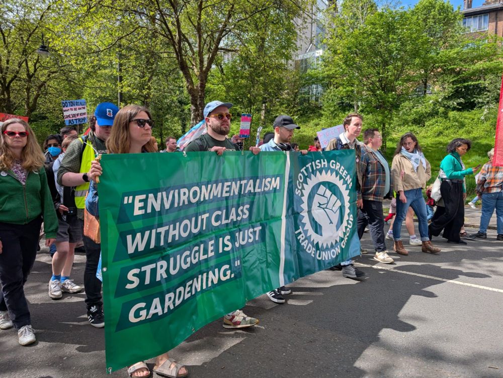 Green bloc at Glasgow mayday. Green members holding banner reading "Environmentalism without class struggle is just gardening" 