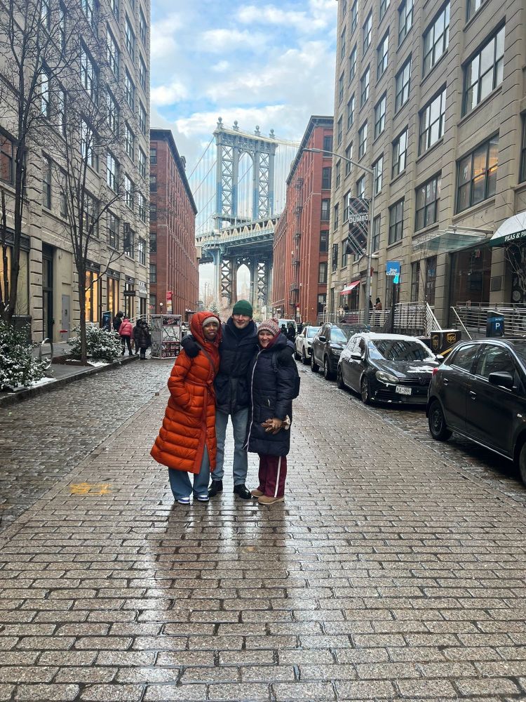 The actors of My Mother’s Funeral: The Show in front of the iconic DUMBO Manhattan Bridge view in New York.